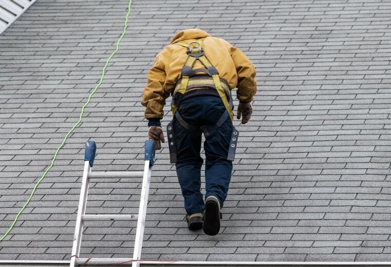 Walking on the Asphalt Roof Damage